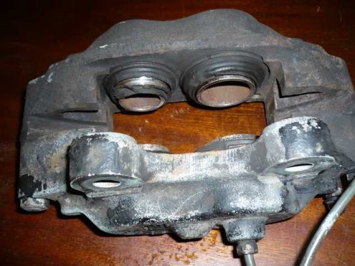 Brake caliper in need of seal replacement.JPG