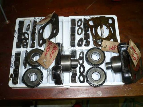 Swivel hub parts sorted for cleaning.JPG