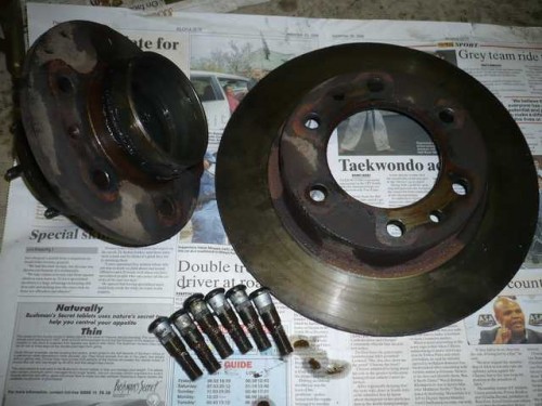 Hub separated from brake disk with studs removed.JPG