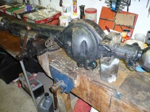 Axle in the vice ready to panelbeat the saddles.JPG