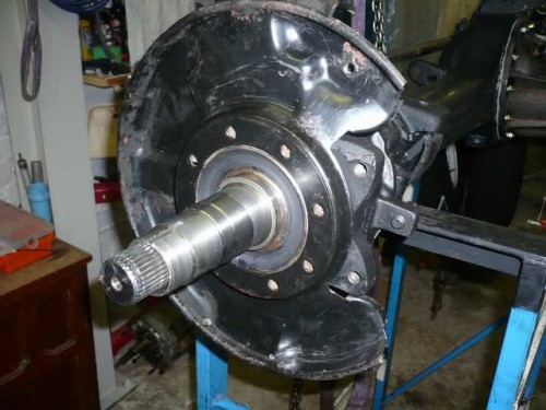 Brake disk dust shield installed on axle spindle.JPG