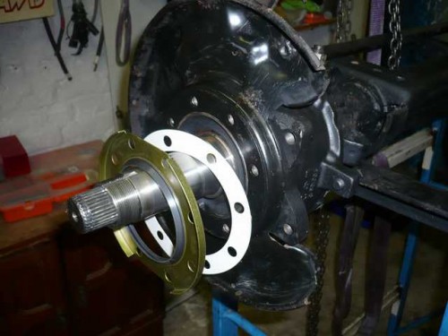 Dust seal and gasket ready for installation on axle spindle.JPG