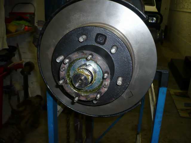 Wheel bearing hub installed on axle spindle.JPG