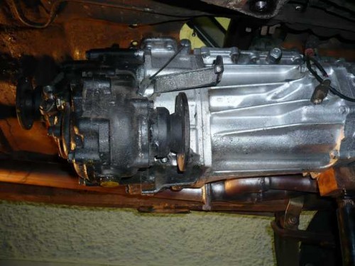 Transmission lowered to allow removal of t-case bolts.JPG