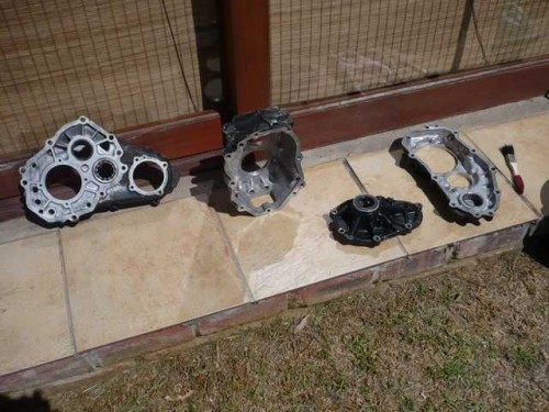 Transfer case housings washed and drying in the sun.JPG