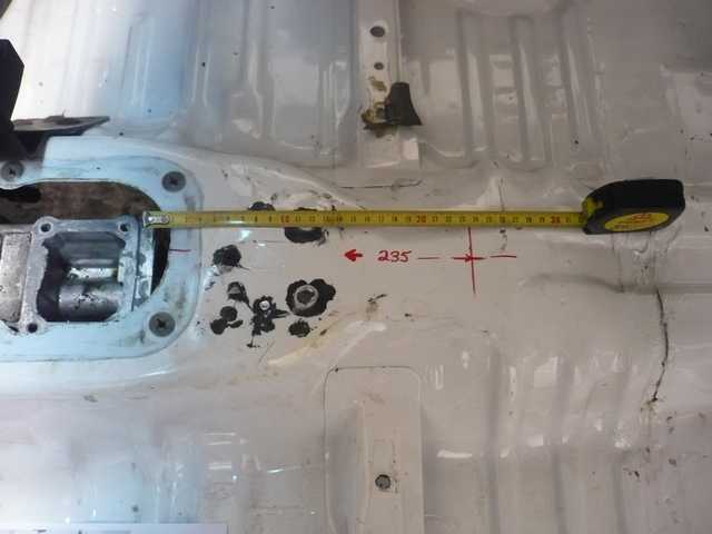 Marking out the hole for the twin stick gearlevers.JPG