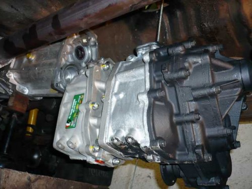 Raising the dual transfer case into position for installation.JPG