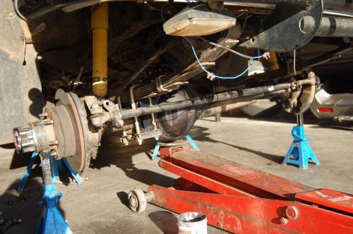 Move axle back into position and place on tressils